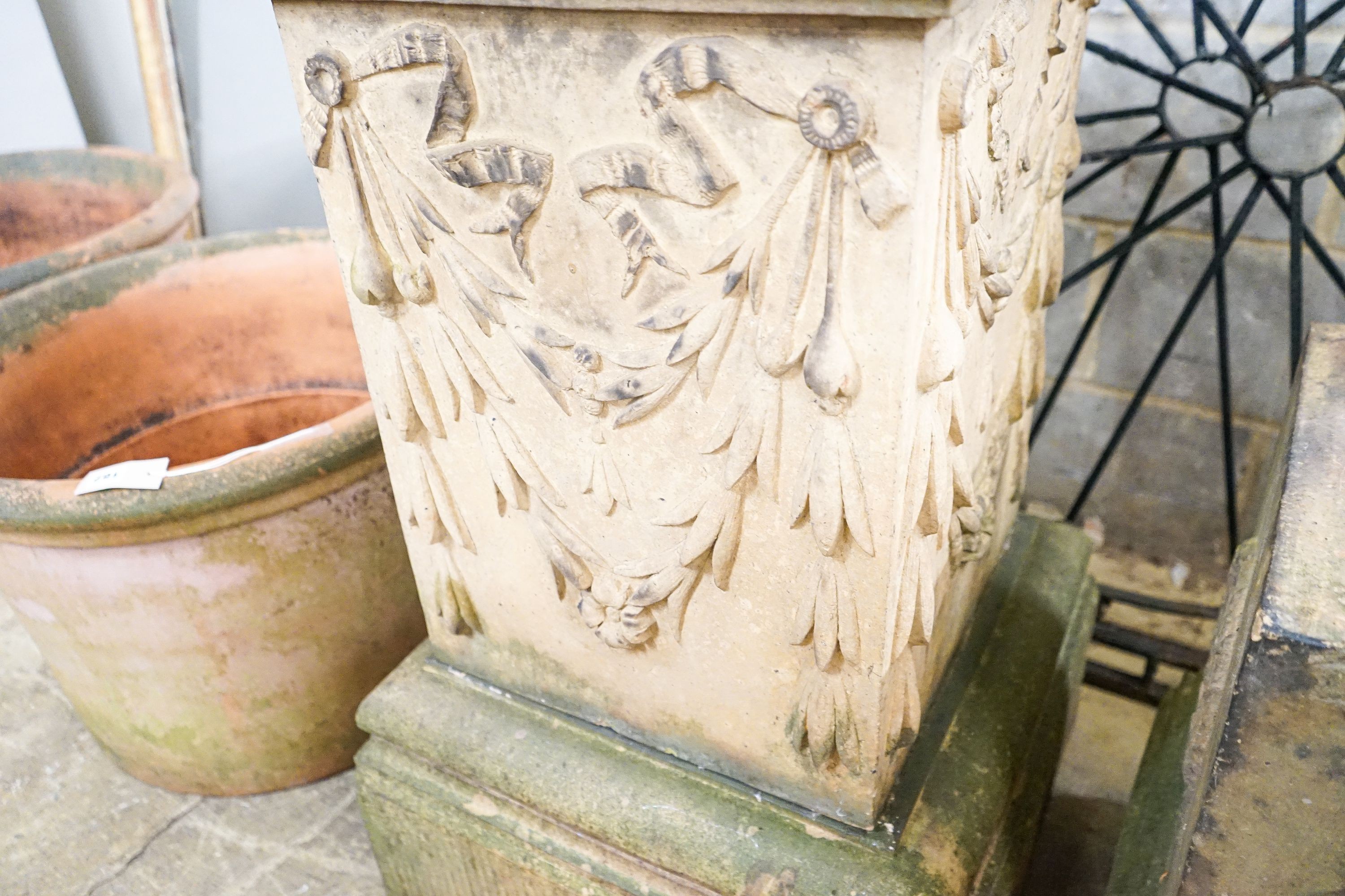 Two moulded terracotta garden pedestals, larger height 92cm